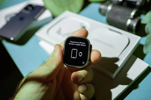 Russian Prompt for iPhone Pairing During Apple Watch Ultra 2 Unboxing Stock Photos