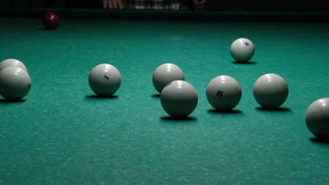 Russian pyramid. Playing in billiards. Cue hits red ball, start of the game Stock Footage 258428665