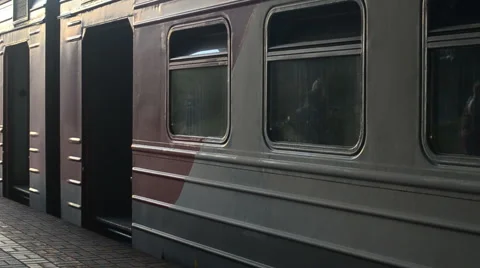 Russian raylways: driving up the train and people entering into the wagons Stock Footage 65196743