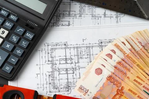 Russian roubles stack on blueprints wth calculator. Renovation, building 스톡 사진