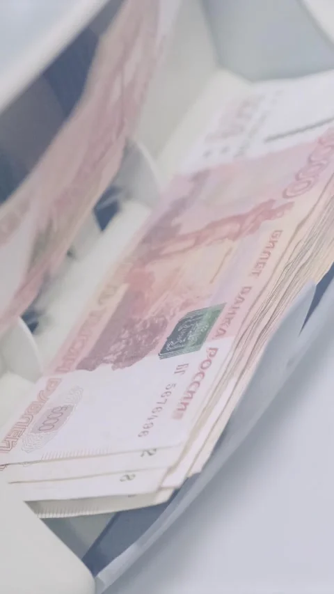 Russian ruble banknotes being rapidly counted in an automatic money counting Video stock 317737233