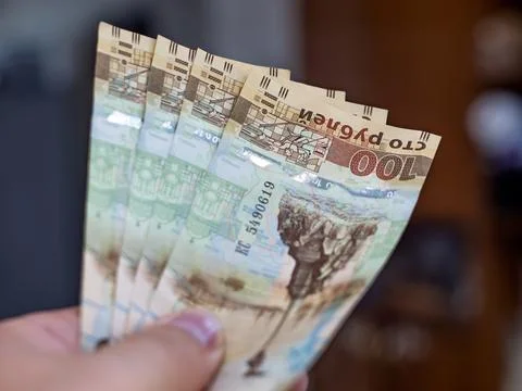 Russian Ruble Banknotes Held in Hand for Transaction Stock Photos