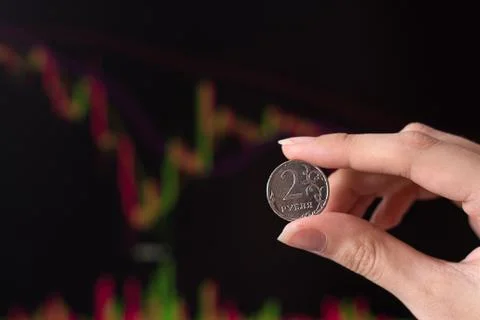 Russian rubles against the background of the exchange's trading schedule. Tra Stock Photos