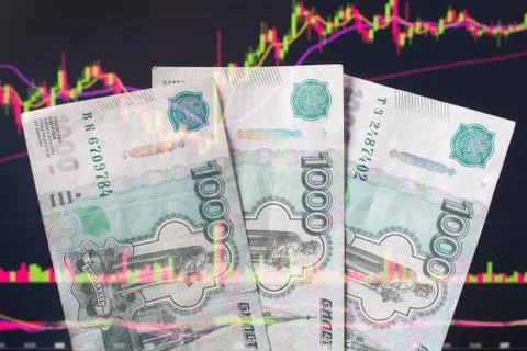Russian rubles against the background of the exchange's trading schedule. Tra Stock Photos