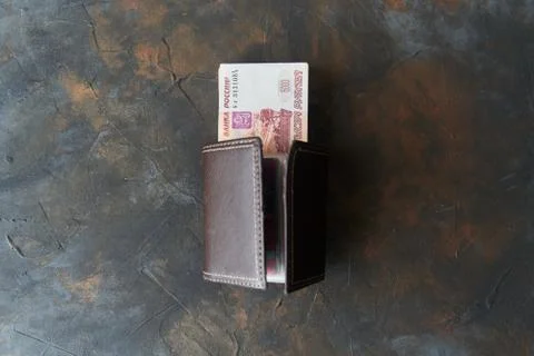 Russian rubles. Five thousandth notes stick out of the wallet. Stock Photos