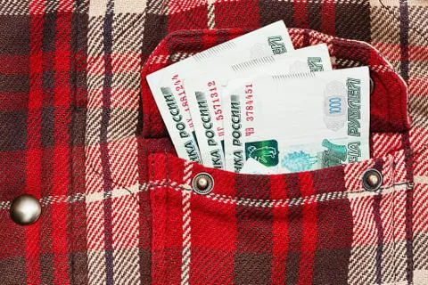 Russian rubles notes in checkered jacket pocket Stock Photos