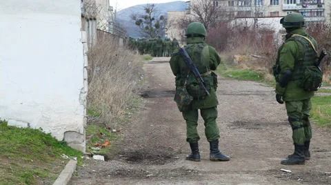 Russian soldiers guarding a naval base on March  4, 2014 in Perevalne, Crimea Stock Footage 35937298