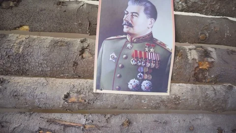 Russian Soviet propaganda poster during WWII hanging on a wall inside old house Stock Footage 107581005