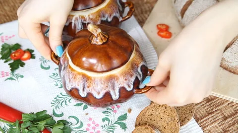 On the Russian table put a pot of food. Soup decorated with dill. Stock Footage 62092129