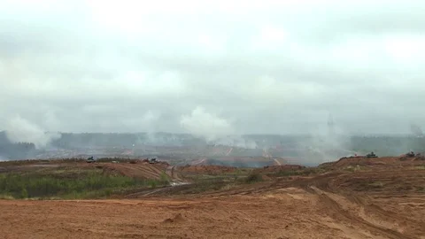 Russian tanks are driving through the field. Burst. Fires. Military equipment. Stock Footage 80991820