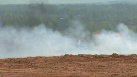 Russian tanks are driving through the field. Burst. Fires. Military equipment. Stock Footage 80991834