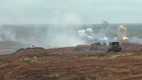 Russian tanks are driving through the field. Burst. Fires. Military equipment. Stock Footage 80991848