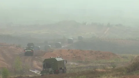 Russian tanks are driving through the field. Burst. Fires. Military equipment. Stock Footage 80991973