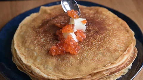 Russian thin pancakes with salmon caviar and butter. Traditional food Stock Footage 146144656