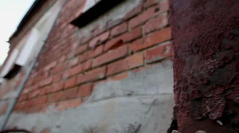 Russian town. An old two-storeyed residential house. Wall with cracked paint. HD Video stock 68706398
