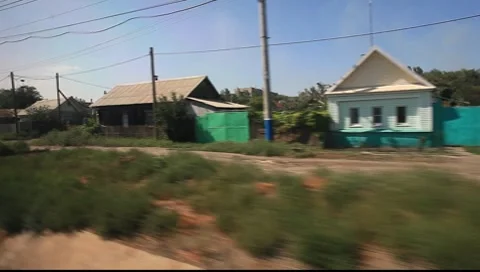 Russian train passing through a Russian Village. Stock Footage 8088155