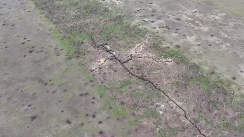 Russian trenches planted in the fields of Ukraine Stockbeeldmateriaal 332354708