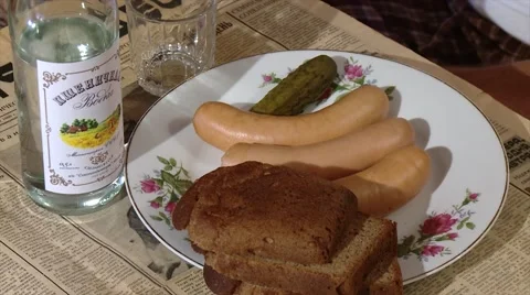 Russian-Ukrainean classic dinner set. Bottle of vodka, sausages. Видео 52175273