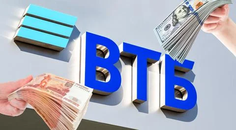 Russian VTB bank logo, stack of american dollars and russian rubles in the .. Stock Photos