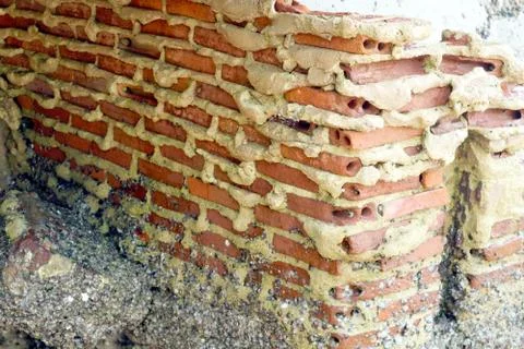 Rust and erosion of brick wall building on beach was damage by storm surge Stock Photos