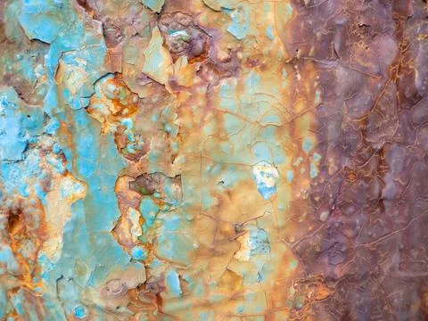 Rust on a blue surface. Cracks in the paint. Old iron. Rusty stains on metal. Stock Photos