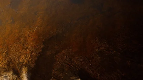 Rust colored texture on a surface in a low light setting showing dark patterns Stock Footage 345011484
