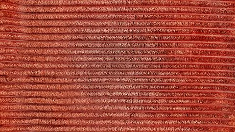 Rust corduroy fabric texture background with horizontal ribbed velvet wales c Fotos de archivo