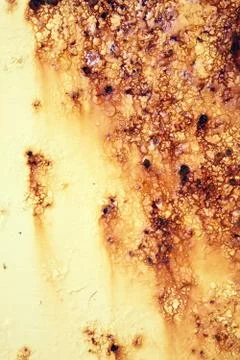 Rust covered weathered metal texture background with yellow peeling blisterin 库存照片
