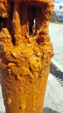 Rust Deposits on Artesian Pump Highlighting Effects of Mineral-Rich Water O.. Stock Photos