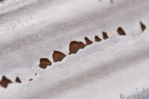 Rust eats away paint on metal. beautiful texture background Stock Photos