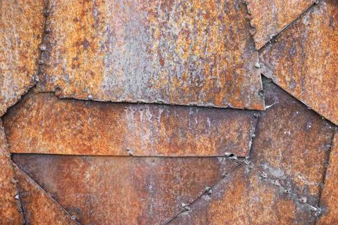 Rust metal texture background. The pieces of metal welded among themselves Stock Photos