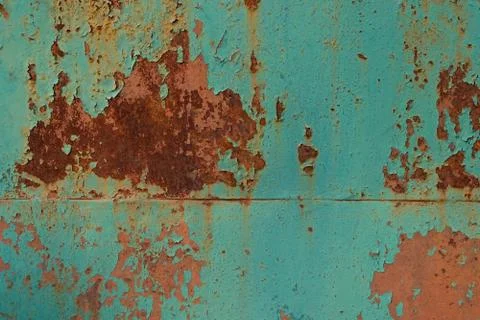 Rust on a painted metal surface. Peeling old paint on gate background. Stock-Fotos