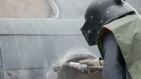 Rust removed by sanblasting the elements of the car body Stock Footage 128263226