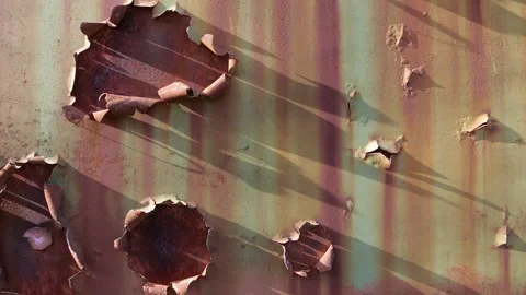 Rust revealed underneath a layer of peeling, scaling and flaking green paint Stock Footage 167515489