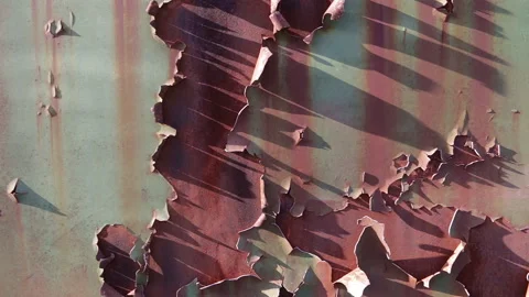 Rust revealed underneath a layer of peeling, scaling and flaking green paint Stock Footage 167524777