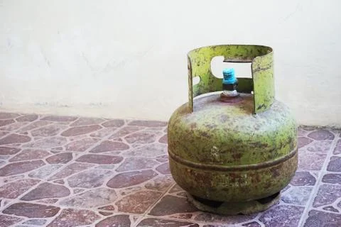 Rust rust greenness lpg propane buthane fuel gas cylinder on the vintage brow Stock Photos