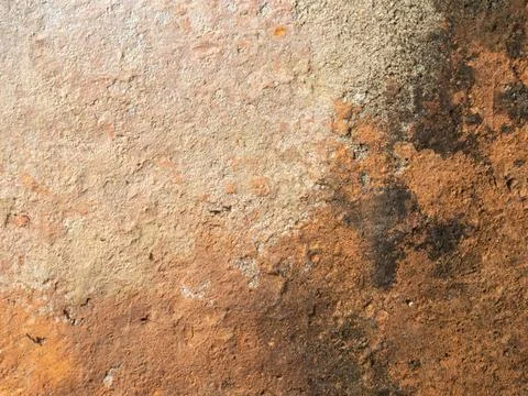 Rust stains spread across weathered metal surface Stock Photos