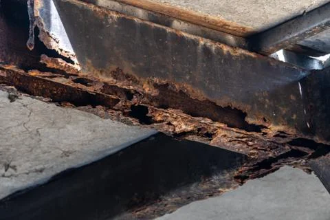 Rust on steel structural columns &amp; post floor support. Stock Photos