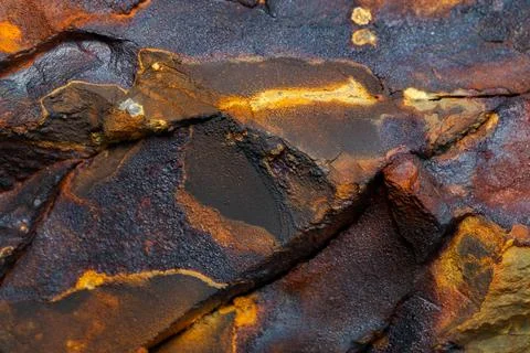 Rust stone wall stone texture image use for backgrounds or textures Stock Photos