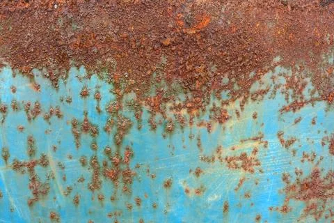 Rust texture on blue metal surface Stock Photos