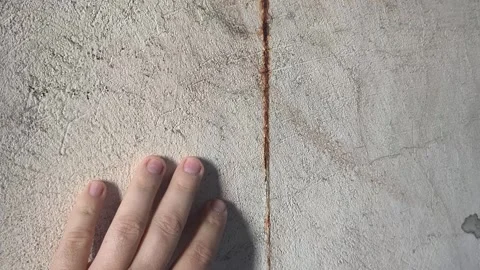 Rust on the wall. man touching the wall with his hand. closing leaking zinc.. Stock Footage 314830088