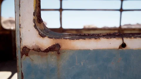 Rust window detail of an abandoned bus in Atacama desert, South America, Video stock 107894560
