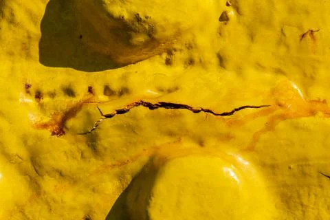 Rust on a Yellow Paint Surface Stock Photos