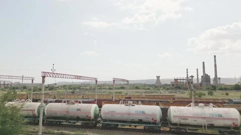 Rustavi, Georgia - 2025: Freight train with Texol tanker wagons moves past .. Stock Footage 312443890