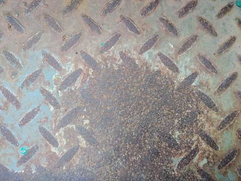 Rusted and broken surface of diamond plate metal sheet texture Stock Photos