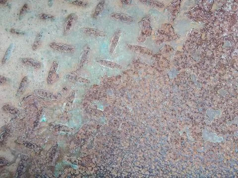 Rusted and broken surface of diamond plate metal sheet texture Stock Photos
