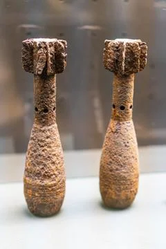 Rusted artillery shells, historical artifacts, positioned side by side, empha Stock Photos