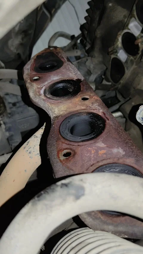 Rusted automotive component with multiple circular ports in engine bay Stock Footage 346638320
