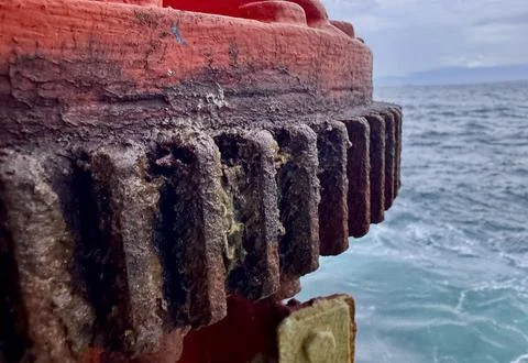 Rusted Bunker Davit Structure On Cargo Ship With Ocean Background Stock Photos