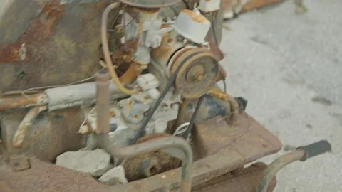 Rusted car engine and corroded parts in a scrapyard Video stock 347035530